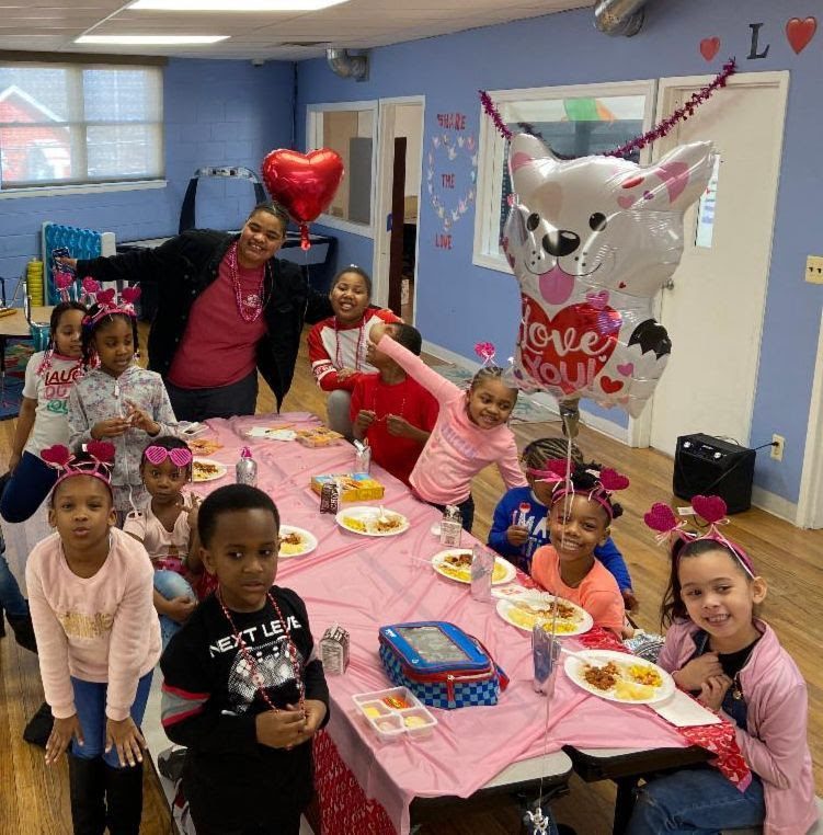 BGCM Memers Celebrating Valentine's Day at the Club Gathered Around a Table
