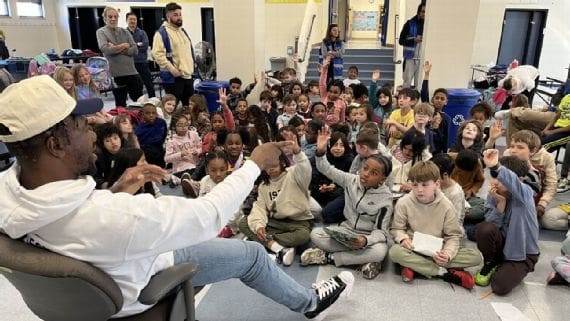 Bobby Okereke speaks to a group of children at the Boys & Girls Club in Monmouth County, New Jersey. Photo via BGCNJ and ESPN